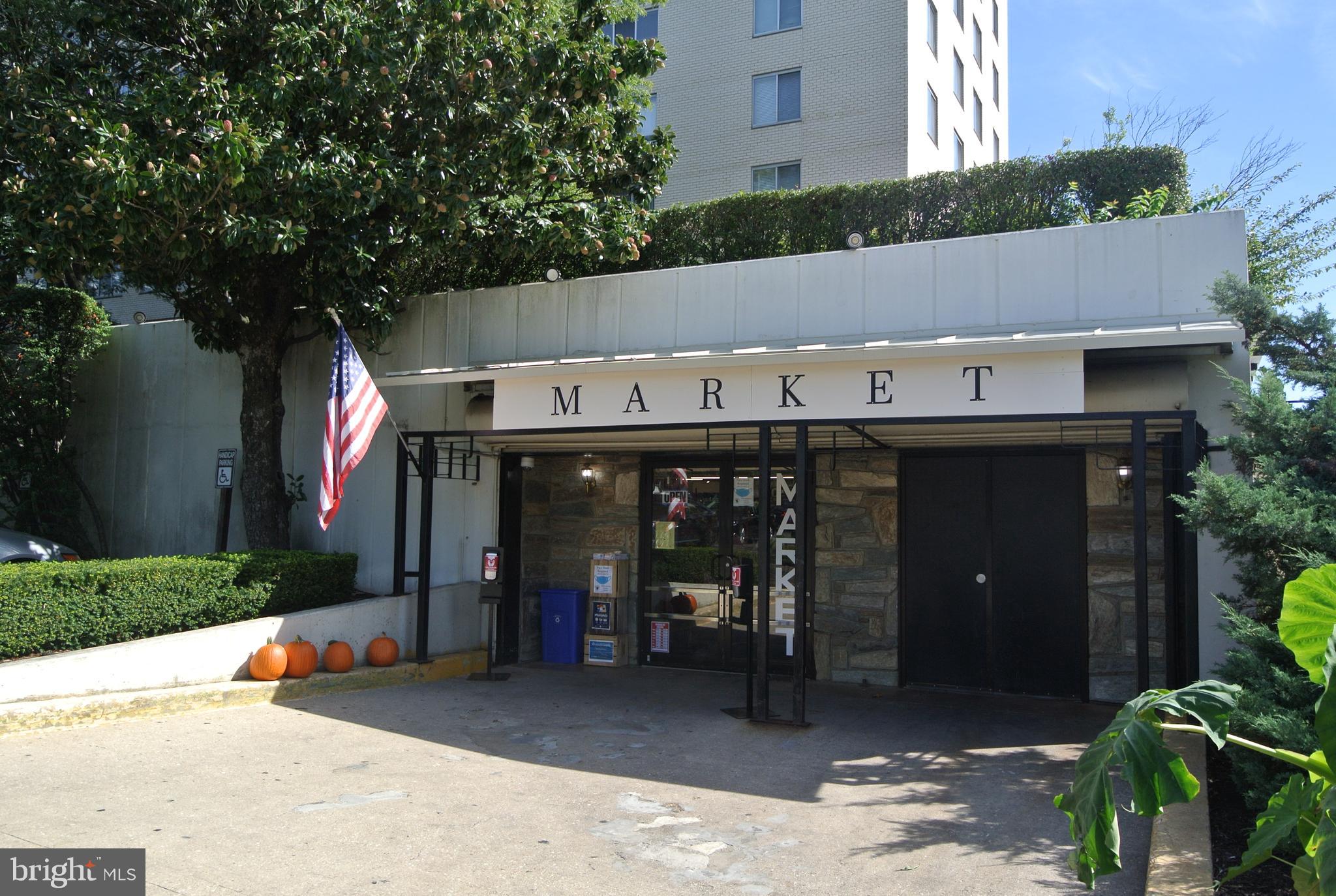 5465 Grove Ridge Way, Unit 123 Rockville, MD 20852 - Photo 34 of 39 a view of a chairs and tables in the patio