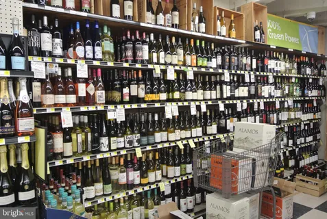 a view of a living room with kitchen