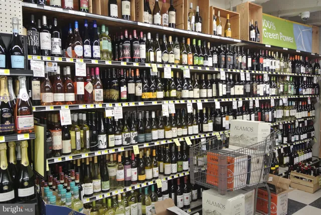 a view of a living room with kitchen