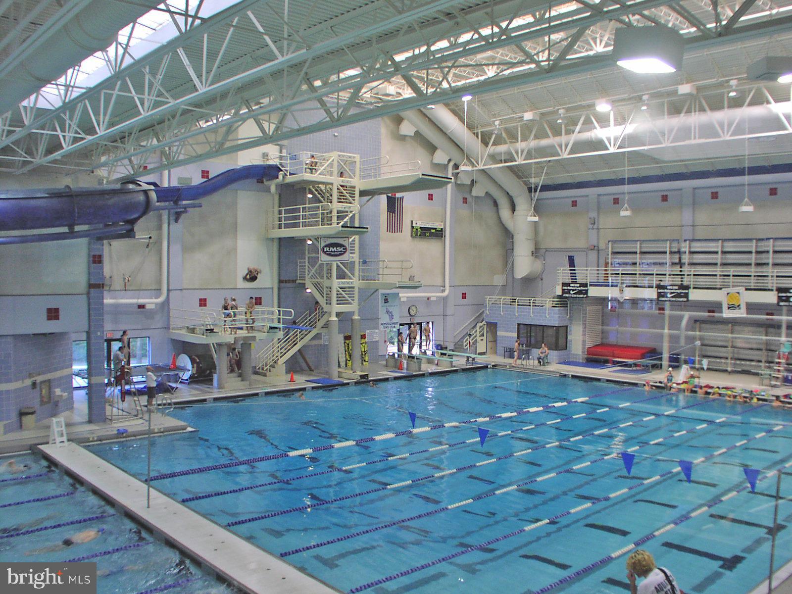 5465 Grove Ridge Way, Unit 123 Rockville, MD 20852 - Photo 37 of 39 a view of a living room with kitchen