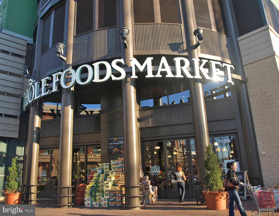 5465 Grove Ridge Way, Unit 123 Rockville, MD 20852 - Photo 39 of 39 a front view of a building with street