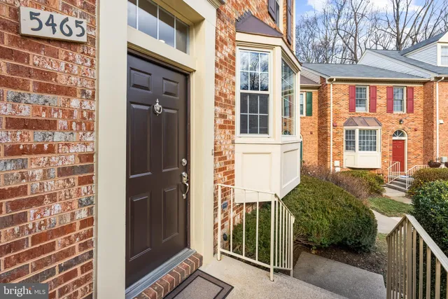 a view of a brick house with a large windows