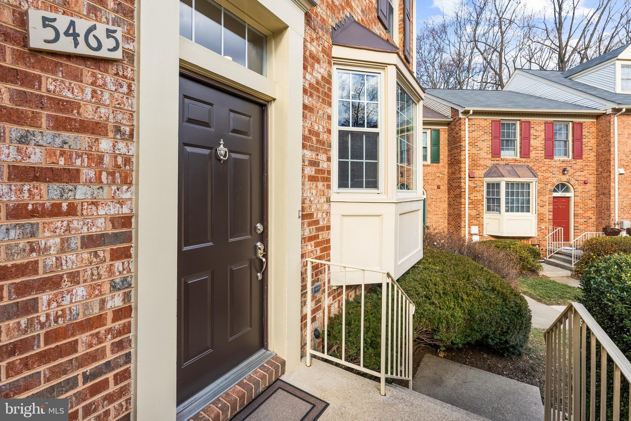 5465 Grove Ridge Way, Unit 123 Rockville, MD 20852 - Photo 4 of 39 a view of a brick house with a large windows