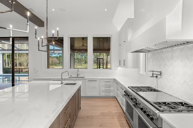 an empty room with wooden floor and a window