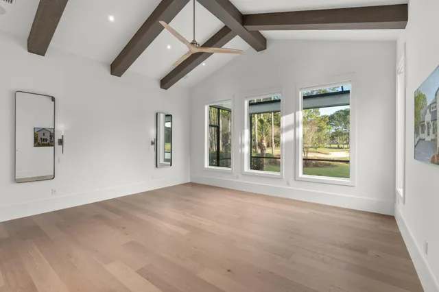 a bathroom with a granite countertop sink a toilet and a mirror
