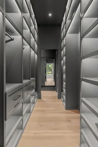 a kitchen with stainless steel appliances granite countertop a sink and a refrigerator