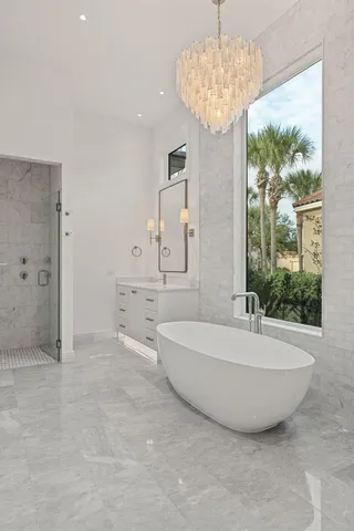 an aerial view of residential houses with outdoor space and river