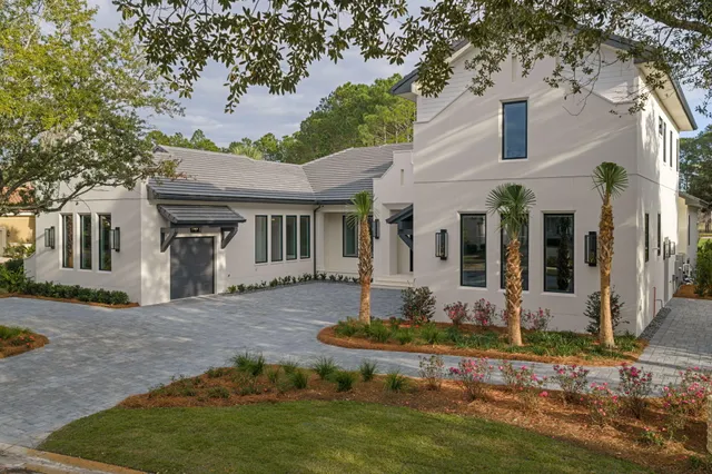 a view of an empty room with a window and staircase