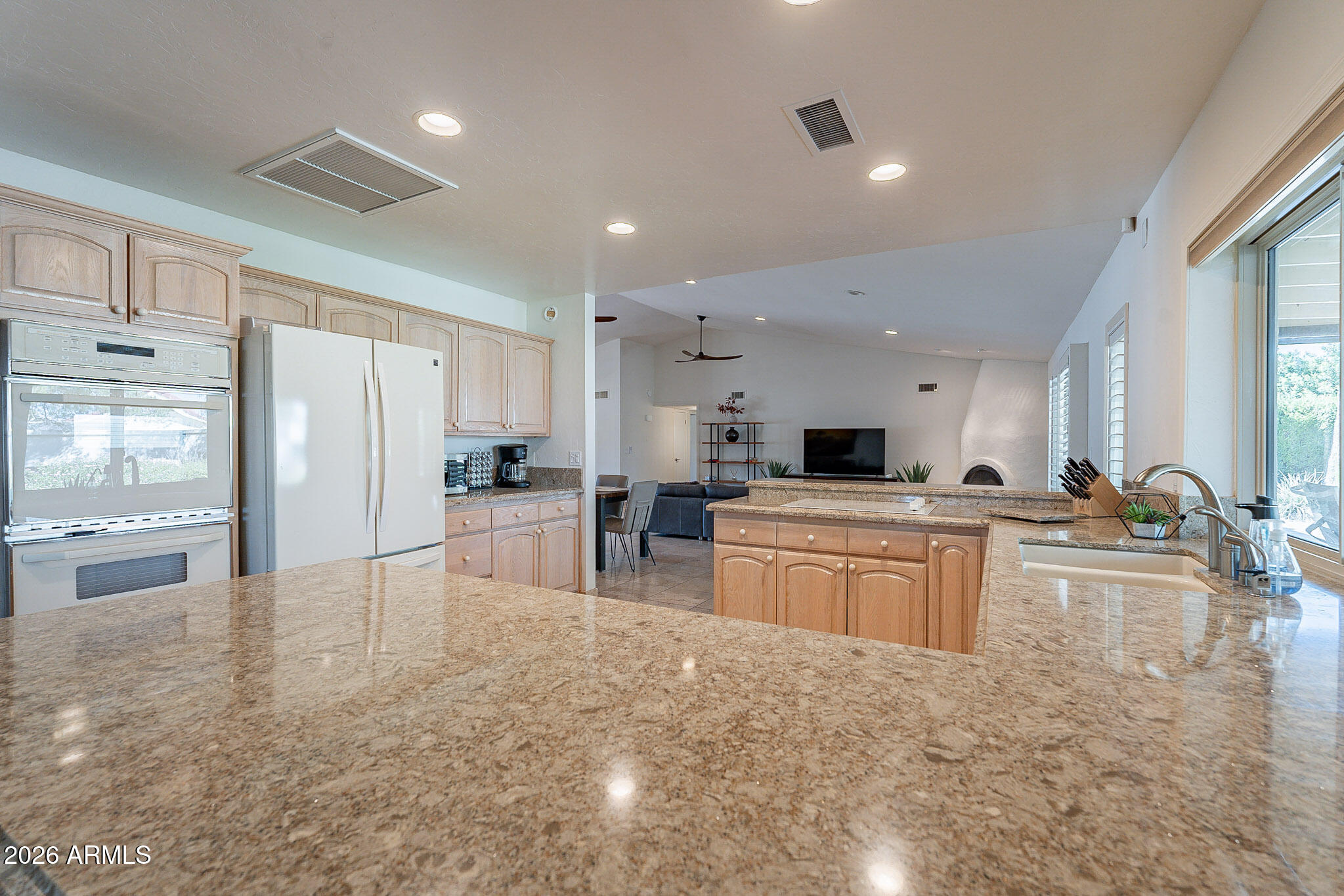 4226 East North Lane Phoenix, AZ 85028 - Photo 18 of 43 a large kitchen with a large counter top appliances and cabinets