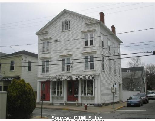 135 Water Street Stonington, CT 06378 - Photo 1 of 1 a front view of a house with a yard