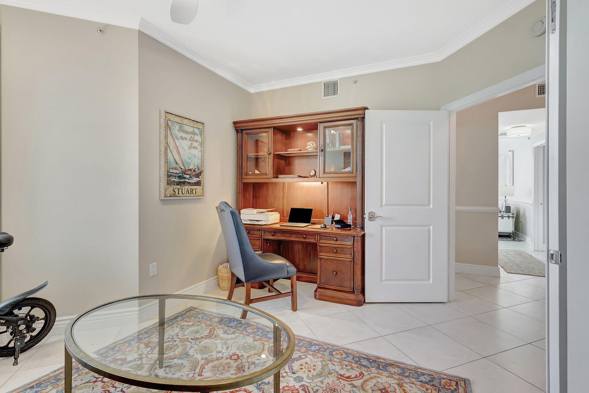 775 Northwest Flagler Avenue, Unit 401 Stuart, FL 34994 - Photo 9 of 56 a room with furniture and window