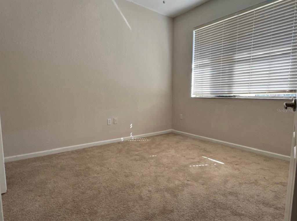 3489 Allegra Circle St. Cloud, FL 34772 - Photo 14 of 29 an empty room with a window