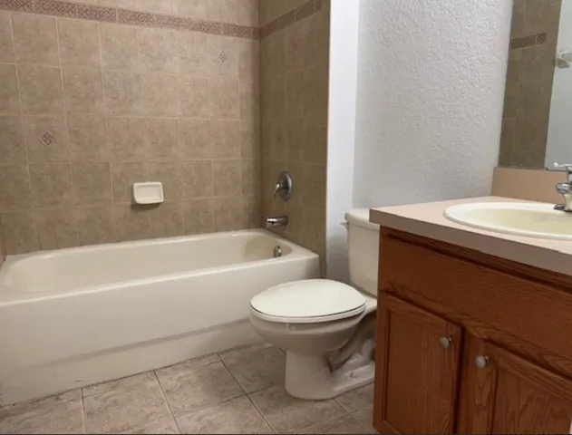 a bathroom with a sink toilet and bathtub