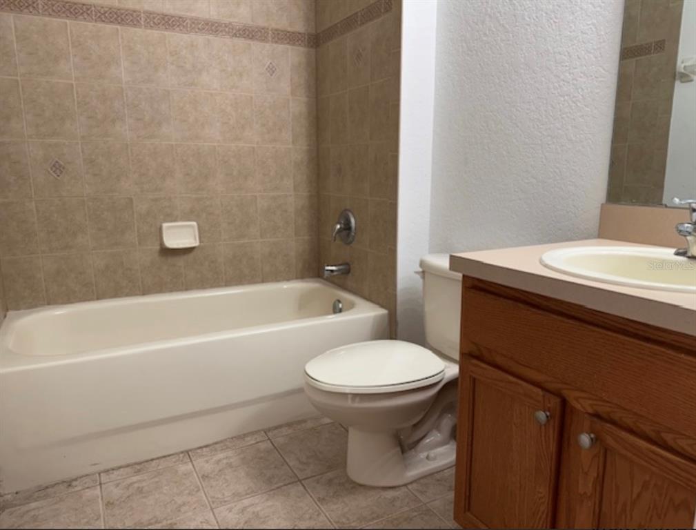 3489 Allegra Circle St. Cloud, FL 34772 - Photo 17 of 29 a bathroom with a sink toilet and bathtub