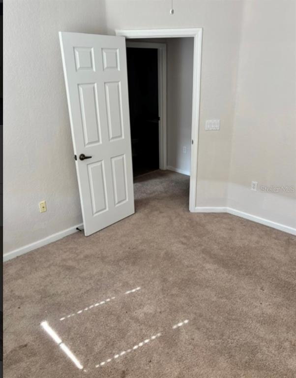 3489 Allegra Circle St. Cloud, FL 34772 - Photo 18 of 29 an empty room with windows