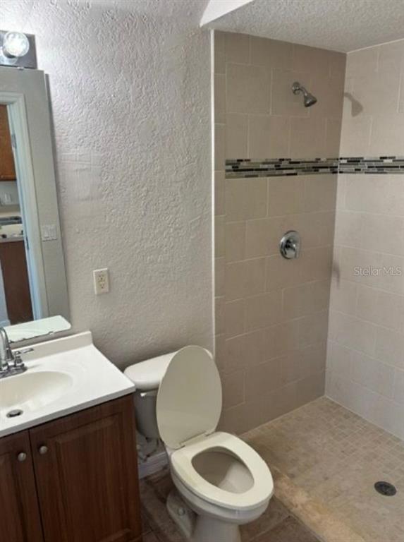 3489 Allegra Circle St. Cloud, FL 34772 - Photo 20 of 29 a bathroom with a sink a toilet and a mirror