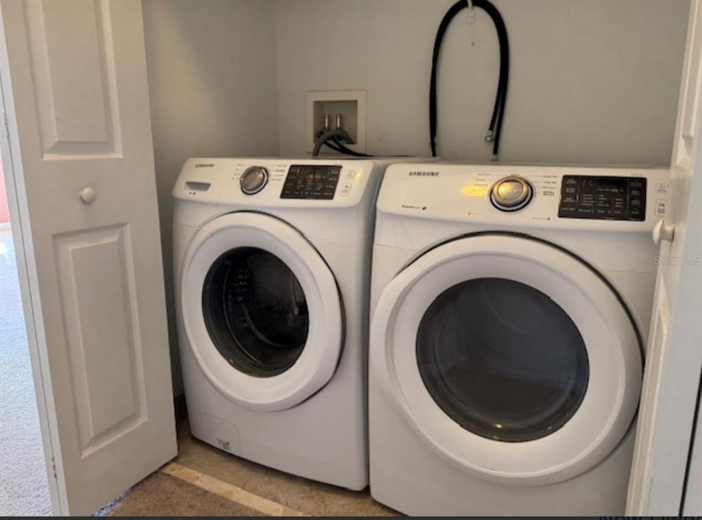 3489 Allegra Circle St. Cloud, FL 34772 - Photo 21 of 29 a utility room with dryer and washer