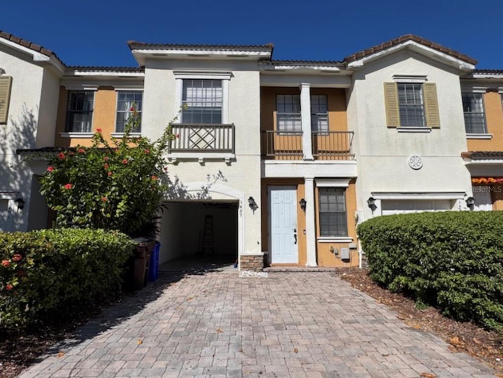 3489 Allegra Circle St. Cloud, FL 34772 - Photo 23 of 29 a front view of a house with a yard