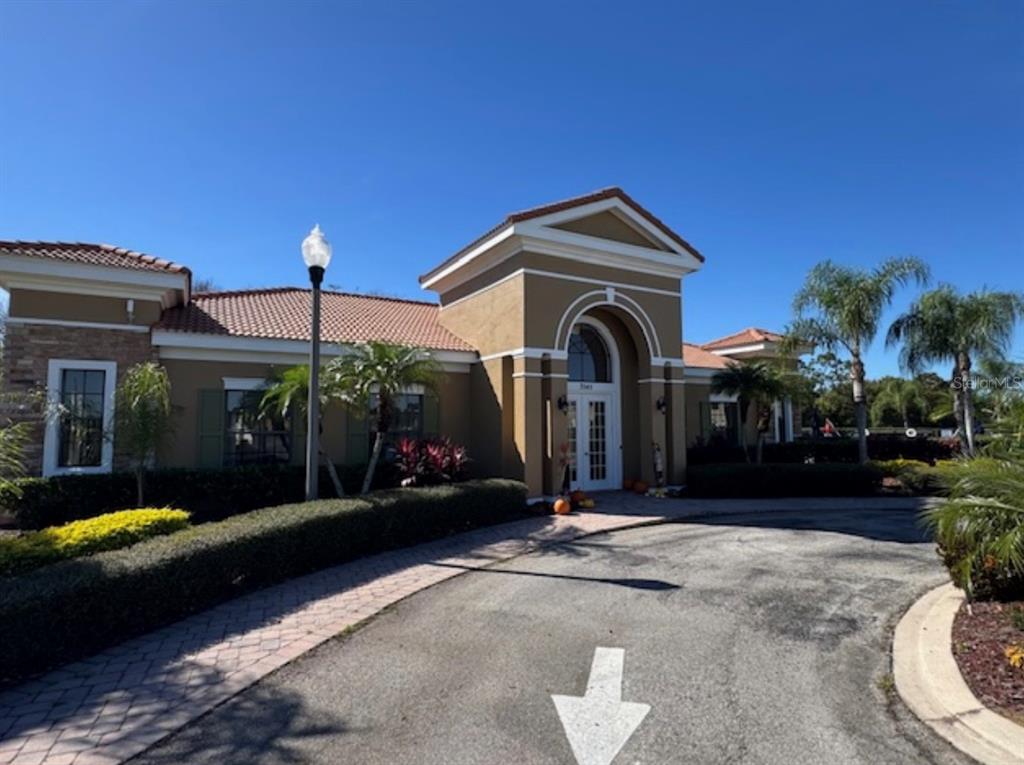 3489 Allegra Circle St. Cloud, FL 34772 - Photo 24 of 29 a view of a car park in front of house
