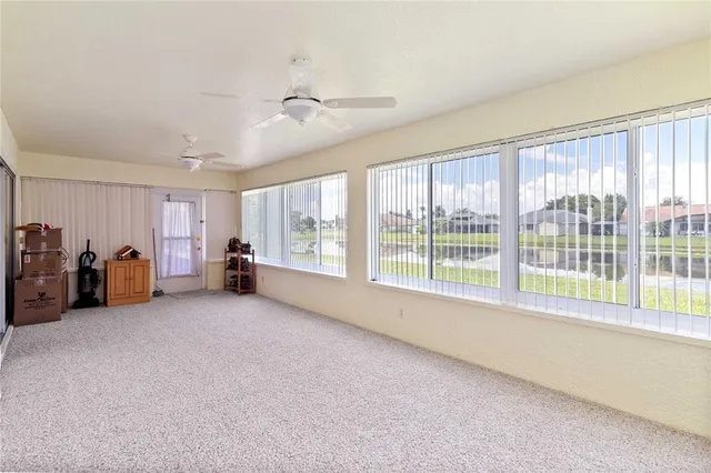a big room with closet and large windows