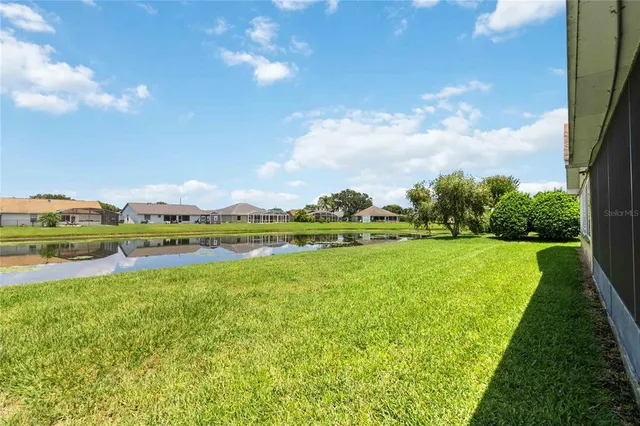 a view of a lake with a big yard