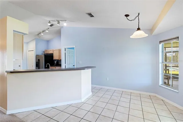 a kitchen with sink and microwave