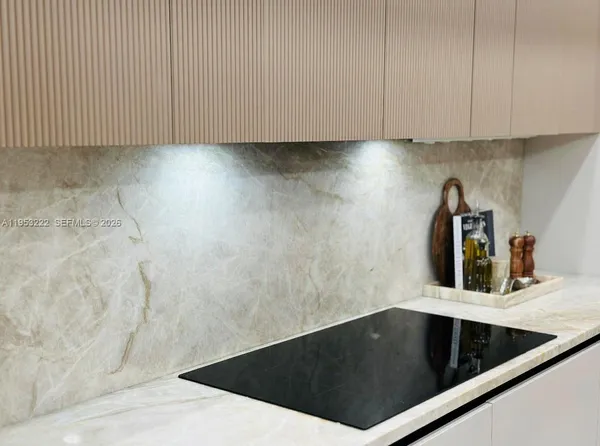 a close view of sink and cabinets