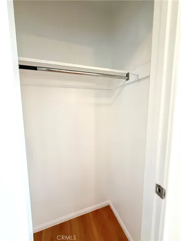 a kitchen with stainless steel appliances kitchen island a refrigerator sink and cabinets