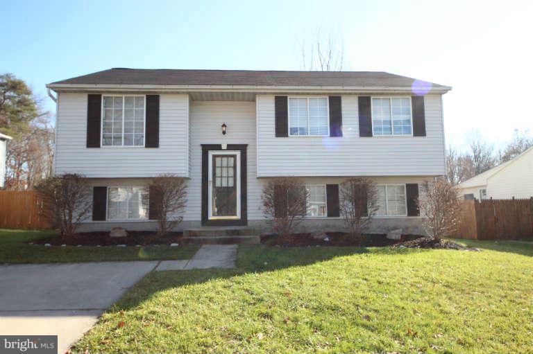 522 Fuselage Avenue Baltimore, MD 21221 - Photo 1 of 16 a front view of a house with a yard