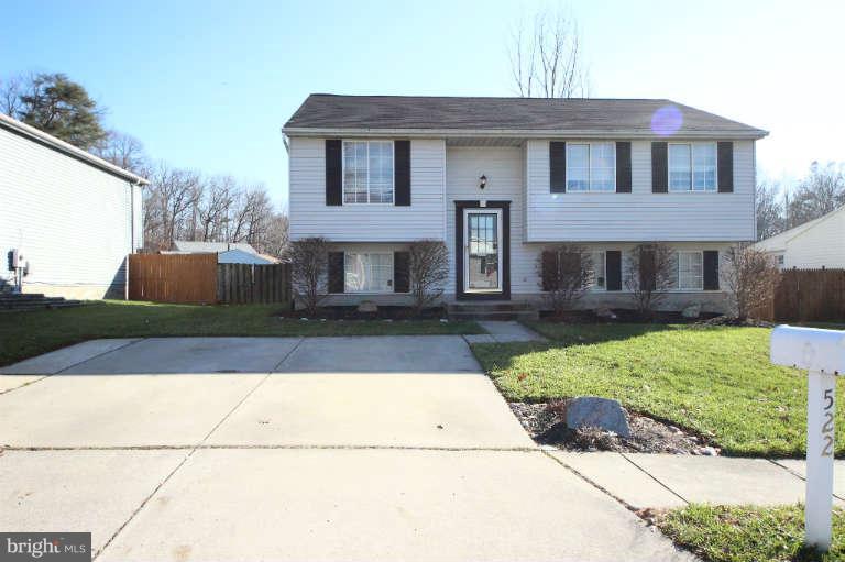 522 Fuselage Avenue Baltimore, MD 21221 - Photo 2 of 16 a front view of a house with a yard