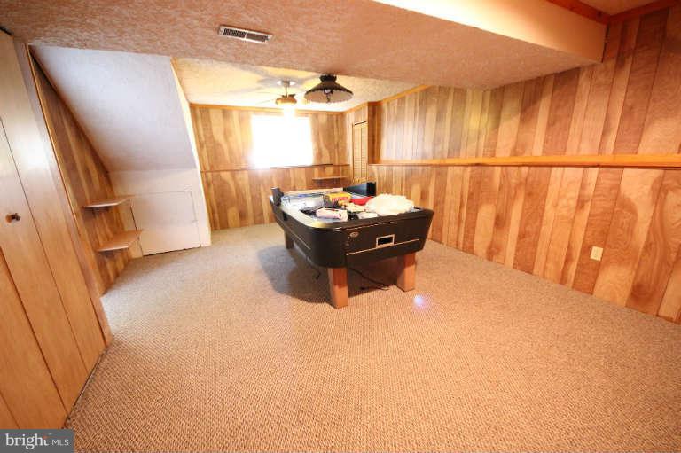 522 Fuselage Avenue Baltimore, MD 21221 - Photo 15 of 16 a living room with furniture and a large window
