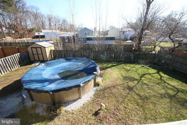 522 Fuselage Avenue Baltimore, MD 21221 - Photo 16 of 16 a view of a swimming pool with two chairs