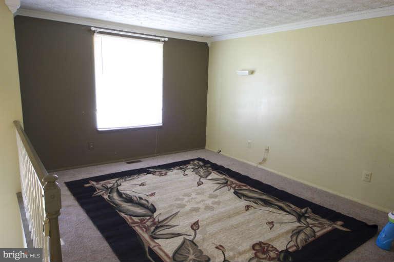 522 Fuselage Avenue Baltimore, MD 21221 - Photo 3 of 16 view of a room with window