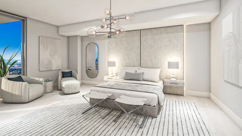 a spacious bedroom with a bed and a chandelier