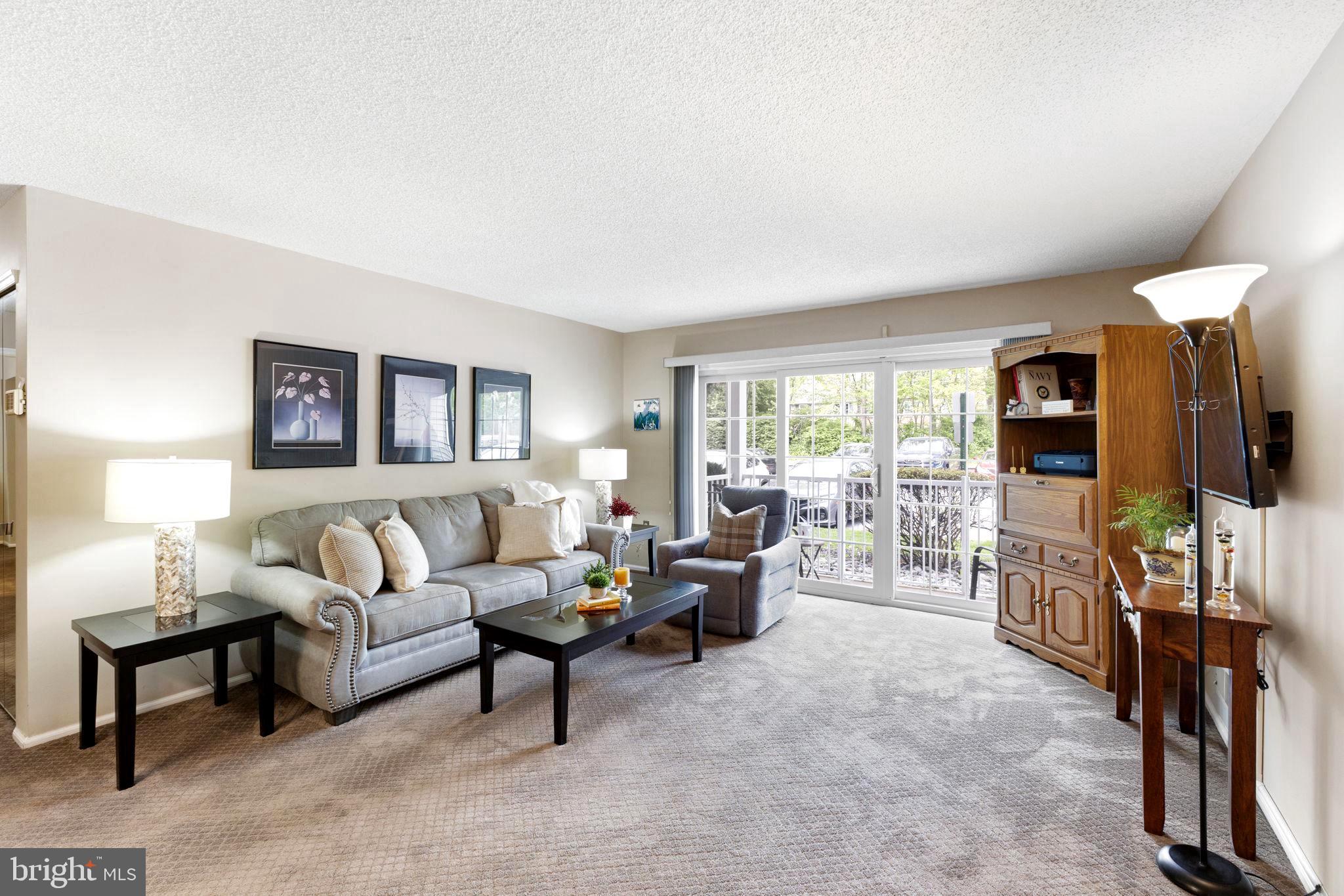 14 Cheverny Court Hamilton, NJ 08619 - Photo 1 of 25 a living room with furniture and a flat screen tv
