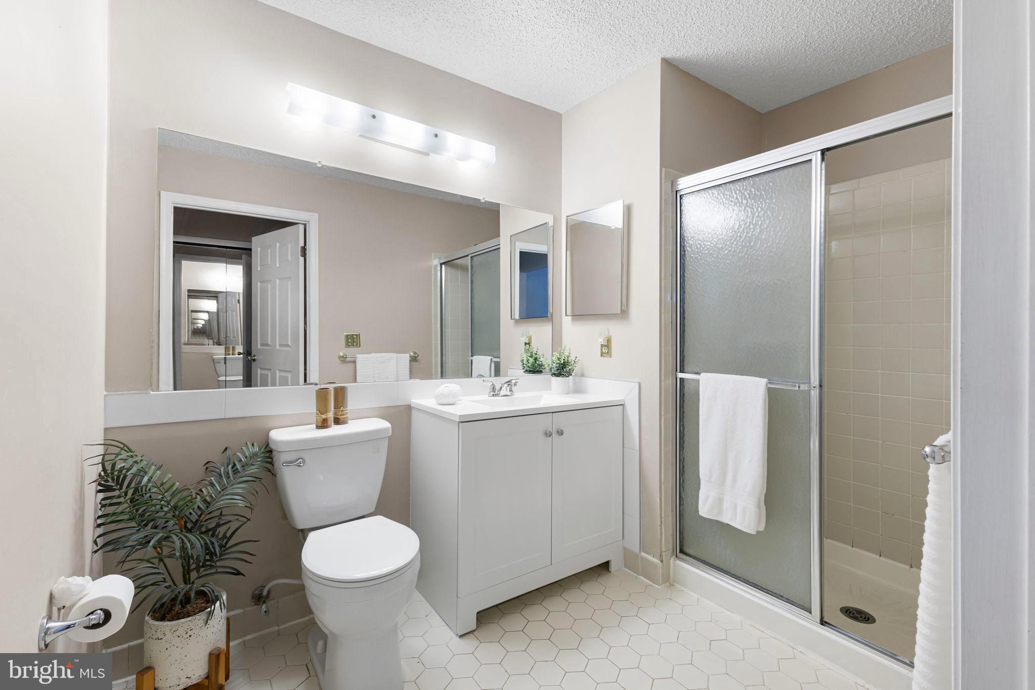 14 Cheverny Court Hamilton, NJ 08619 - Photo 11 of 25 a bathroom with a toilet sink and shower