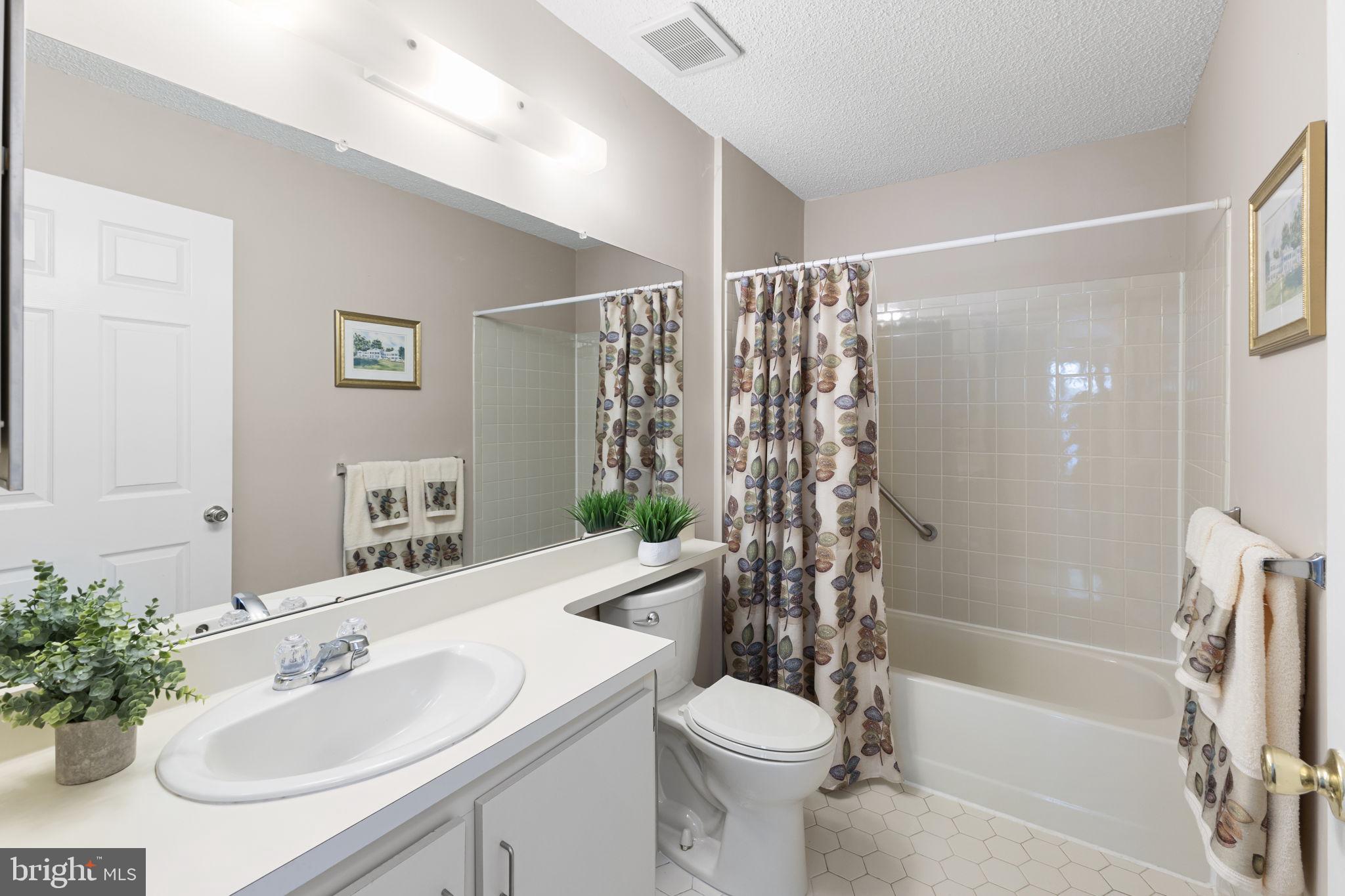 14 Cheverny Court Hamilton, NJ 08619 - Photo 15 of 25 a bathroom with a sink toilet and shower