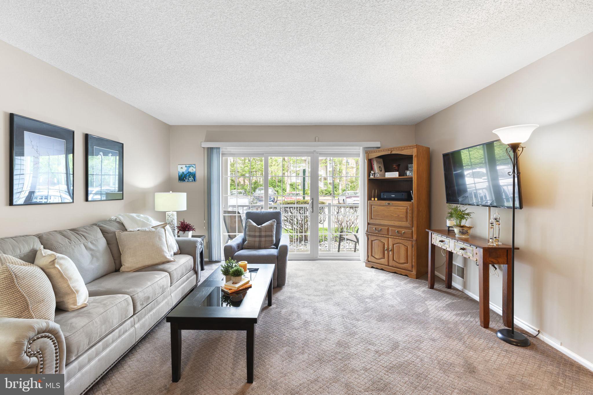 14 Cheverny Court Hamilton, NJ 08619 - Photo 2 of 25 a living room with furniture and a flat screen tv