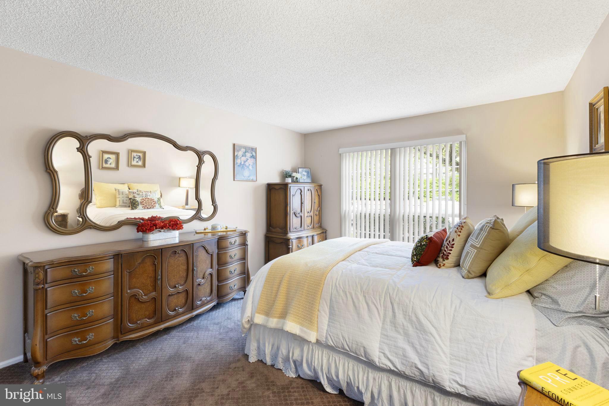 14 Cheverny Court Hamilton, NJ 08619 - Photo 9 of 25 a bedroom with a bed a dresser and mirror