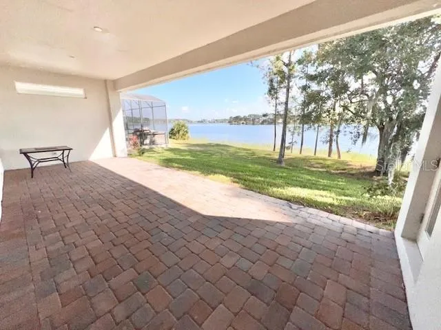 a view of a yard and an empty room