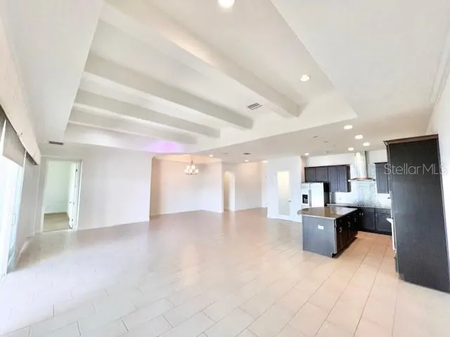 a view of a kitchen with furniture and a kitchen