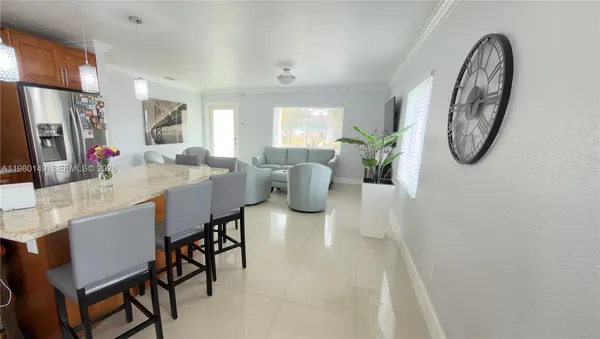 a dining room with furniture a mirror and a chandelier
