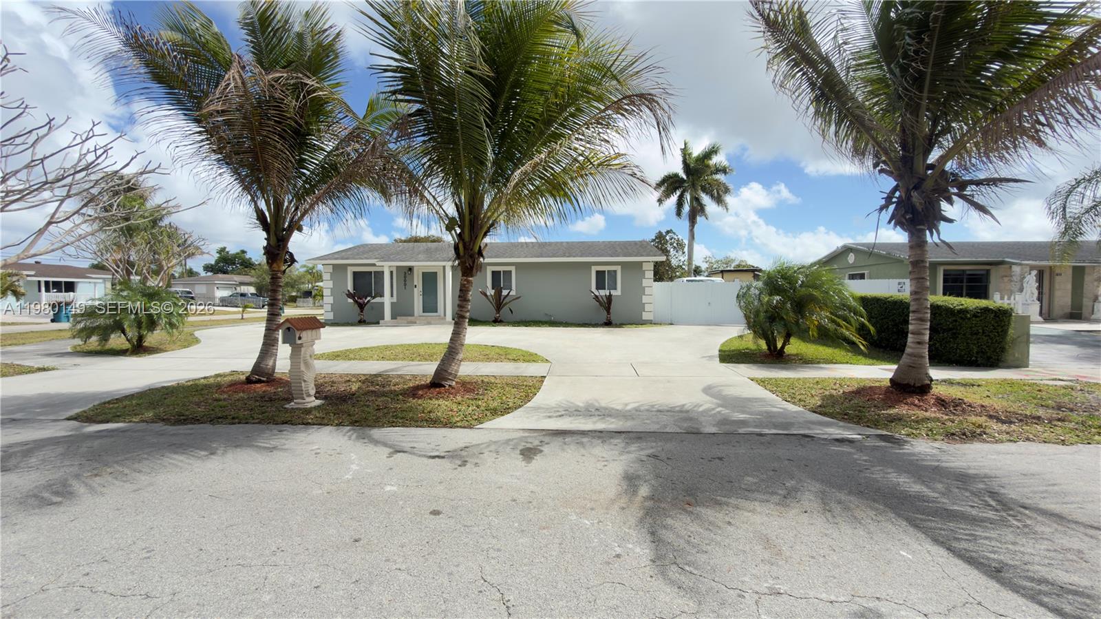 30001 Southwest 153rd Avenue Homestead, FL 33033 - Photo 2 of 55 a front view of a house with garden and tree