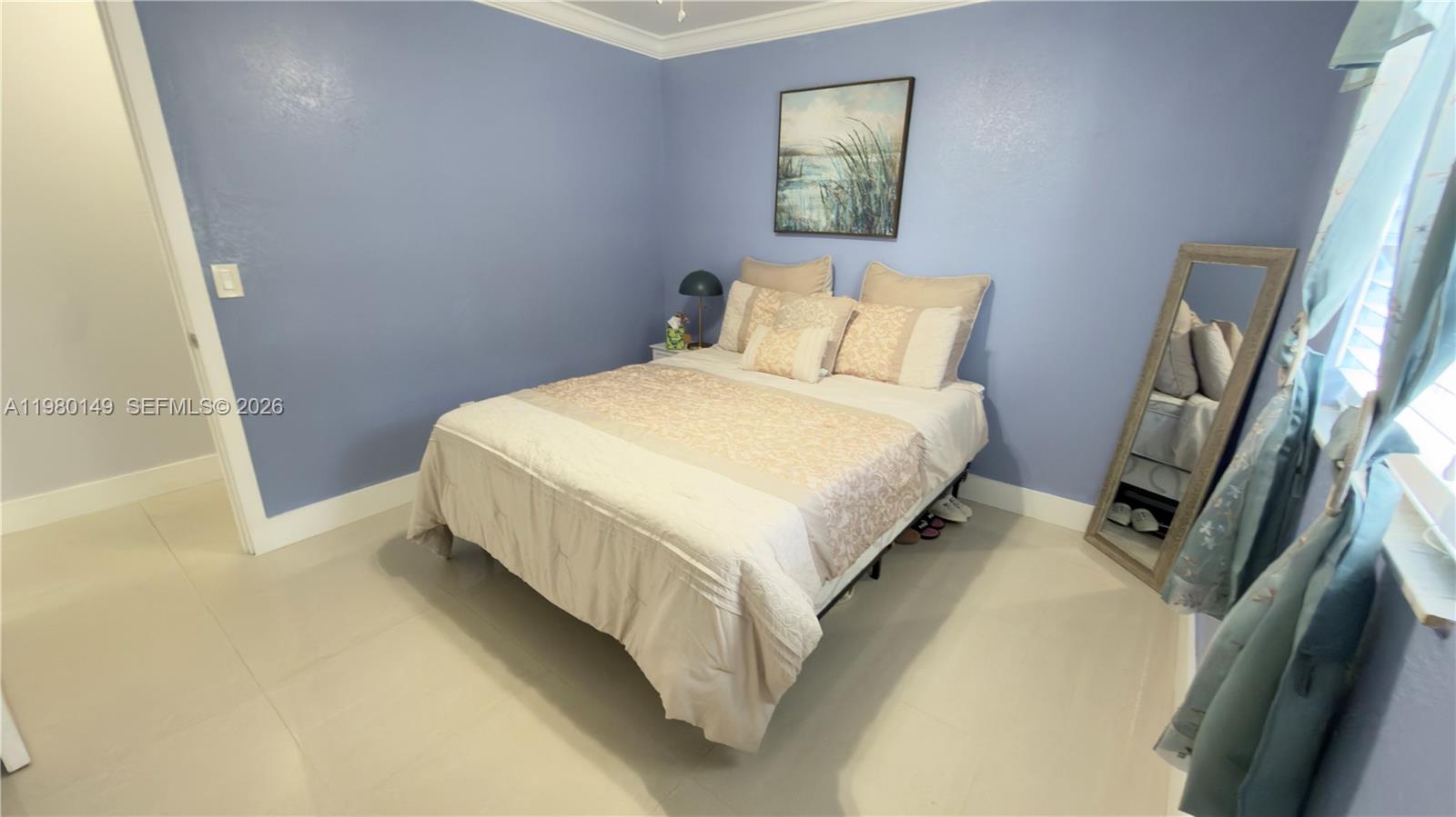 30001 Southwest 153rd Avenue Homestead, FL 33033 - Photo 24 of 55 a bed sitting in a bedroom next to a window