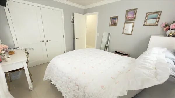 a bedroom with a bed and a sink