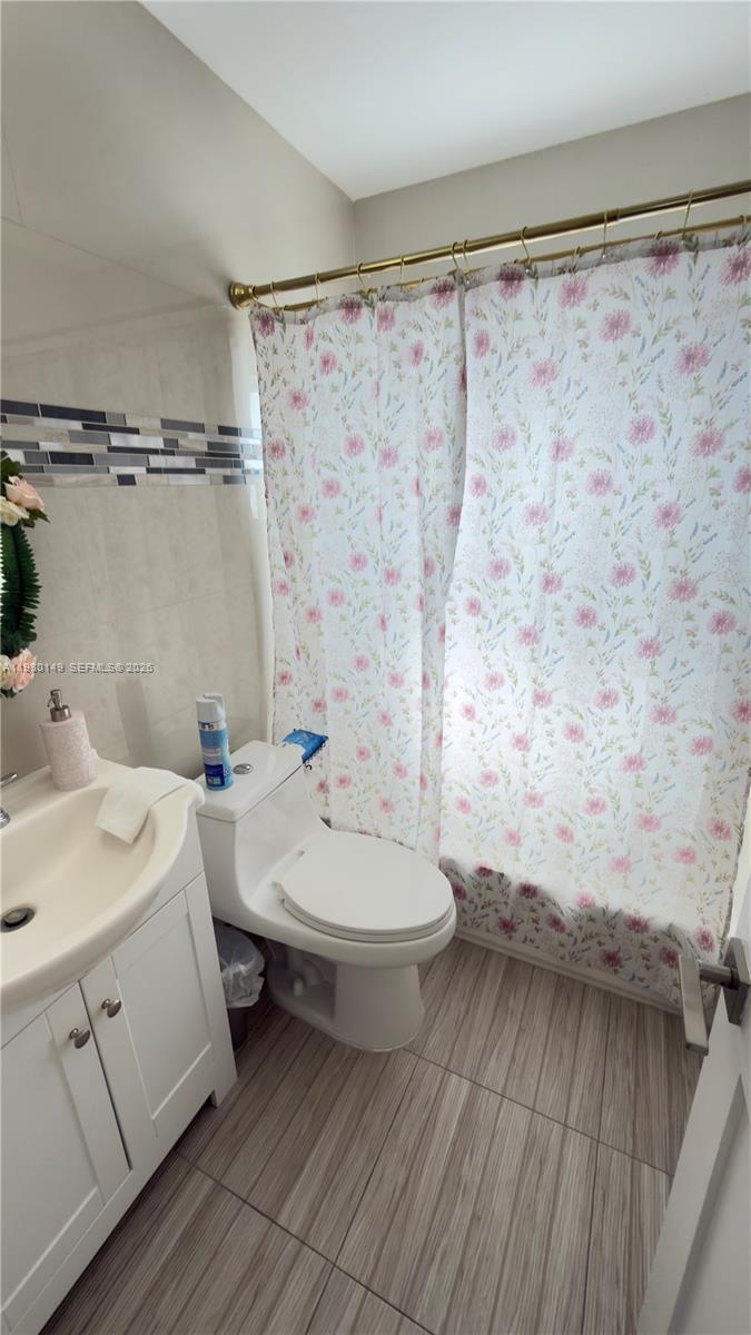 30001 Southwest 153rd Avenue Homestead, FL 33033 - Photo 30 of 55 a bathroom with a sink a toilet and shower