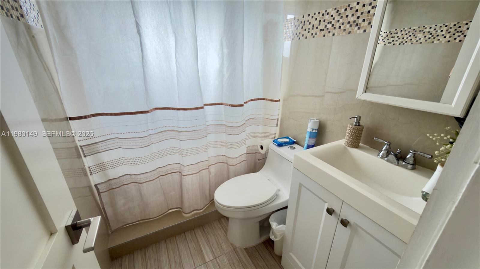 30001 Southwest 153rd Avenue Homestead, FL 33033 - Photo 34 of 55 a bathroom with a sink toilet and a mirror