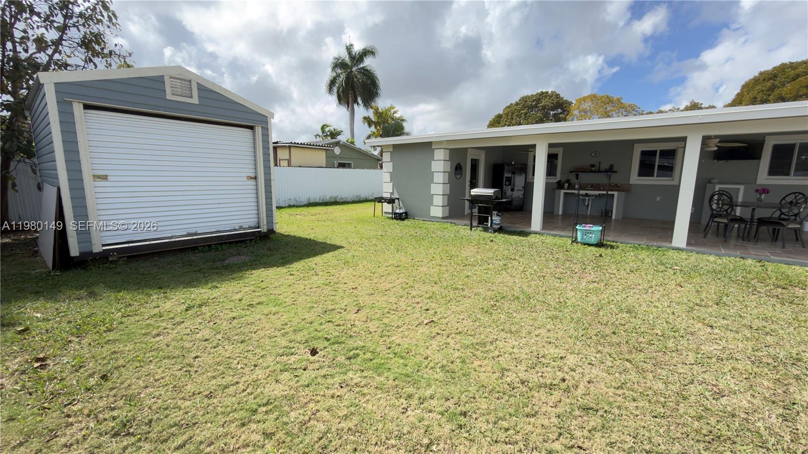 30001 Southwest 153rd Avenue Homestead, FL 33033 - Photo 39 of 55 a view of a house with a yard and sitting area
