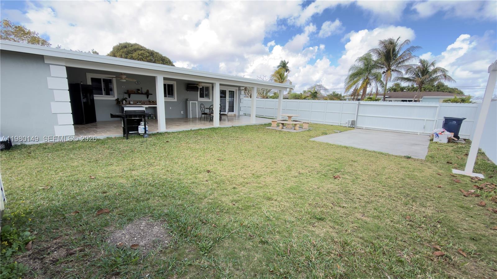 30001 Southwest 153rd Avenue Homestead, FL 33033 - Photo 40 of 55 a view of a house with a backyard and a patio