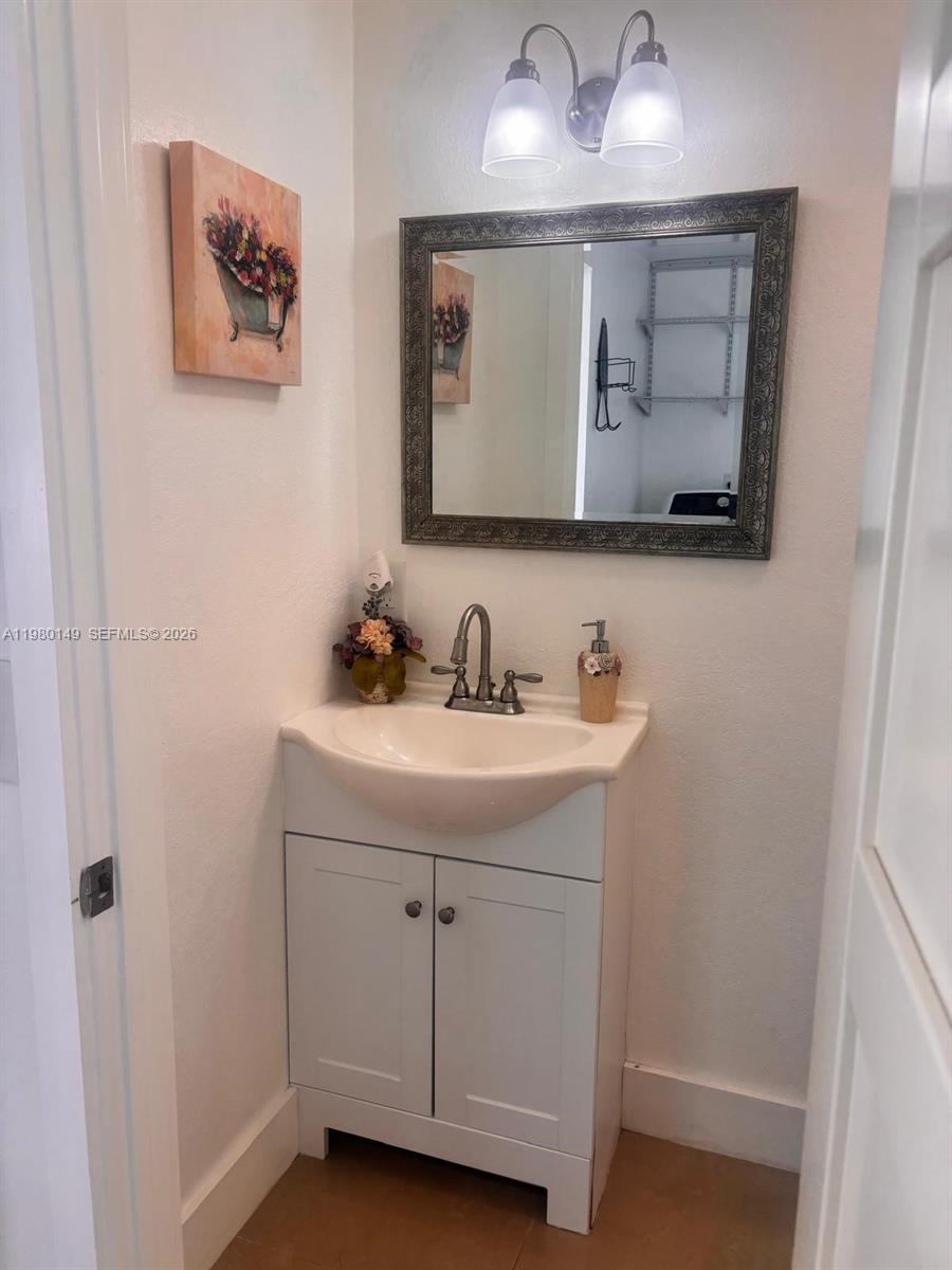 30001 Southwest 153rd Avenue Homestead, FL 33033 - Photo 50 of 55 a bathroom with a sink and a mirror